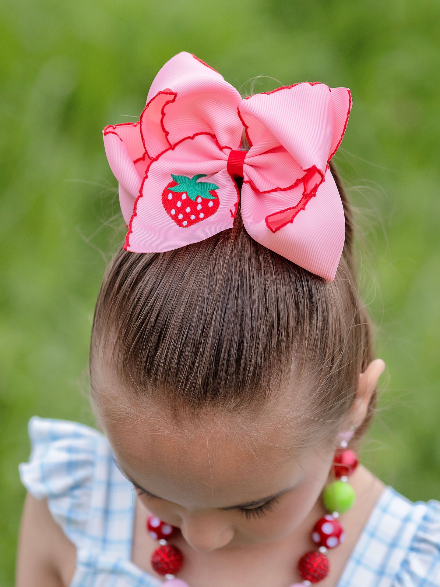 model wearing out Strawberry Embroidered Moonstitch Hair Bow