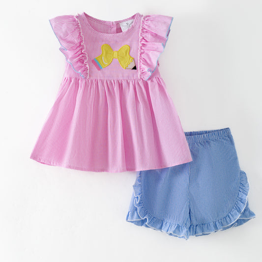 Pink dress with ruffled sleeves and blue shorts on a white background - Alternative view