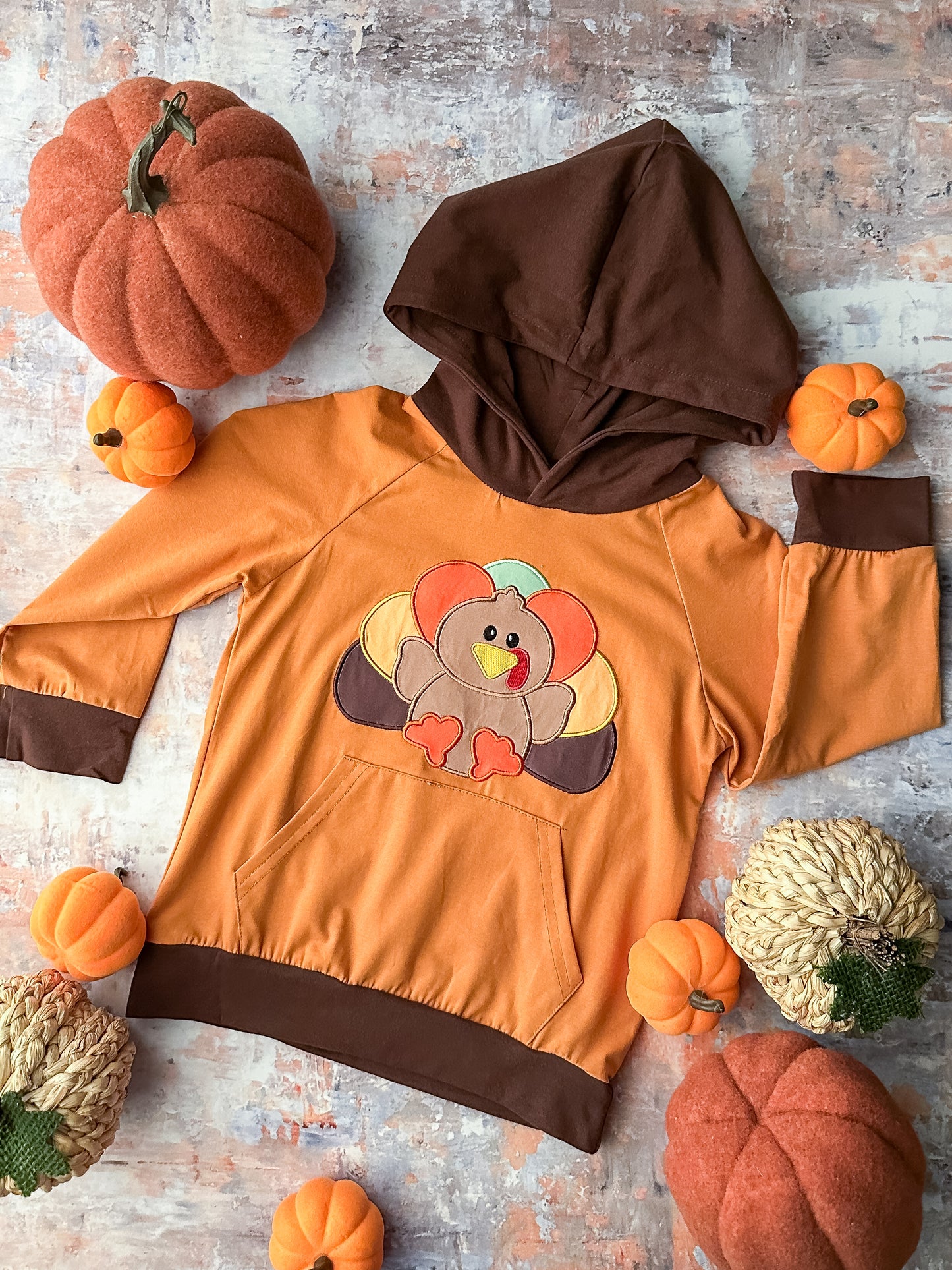 orange long sleeve with turkey and brown hoodie