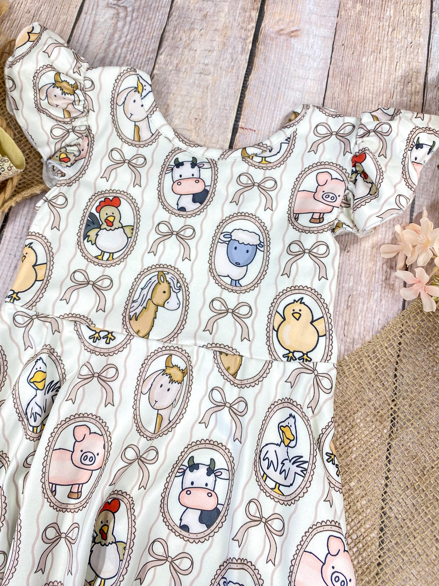 Boutique Girls Farm Animal Dress on a wooden background