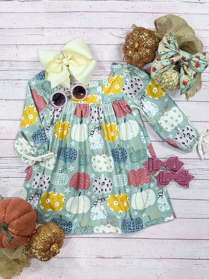 blue dress with an abundance of patterned pumpkins