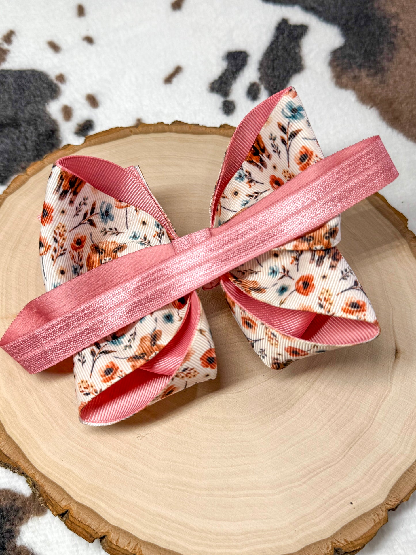 back of the bow headband showing the satin elastic band