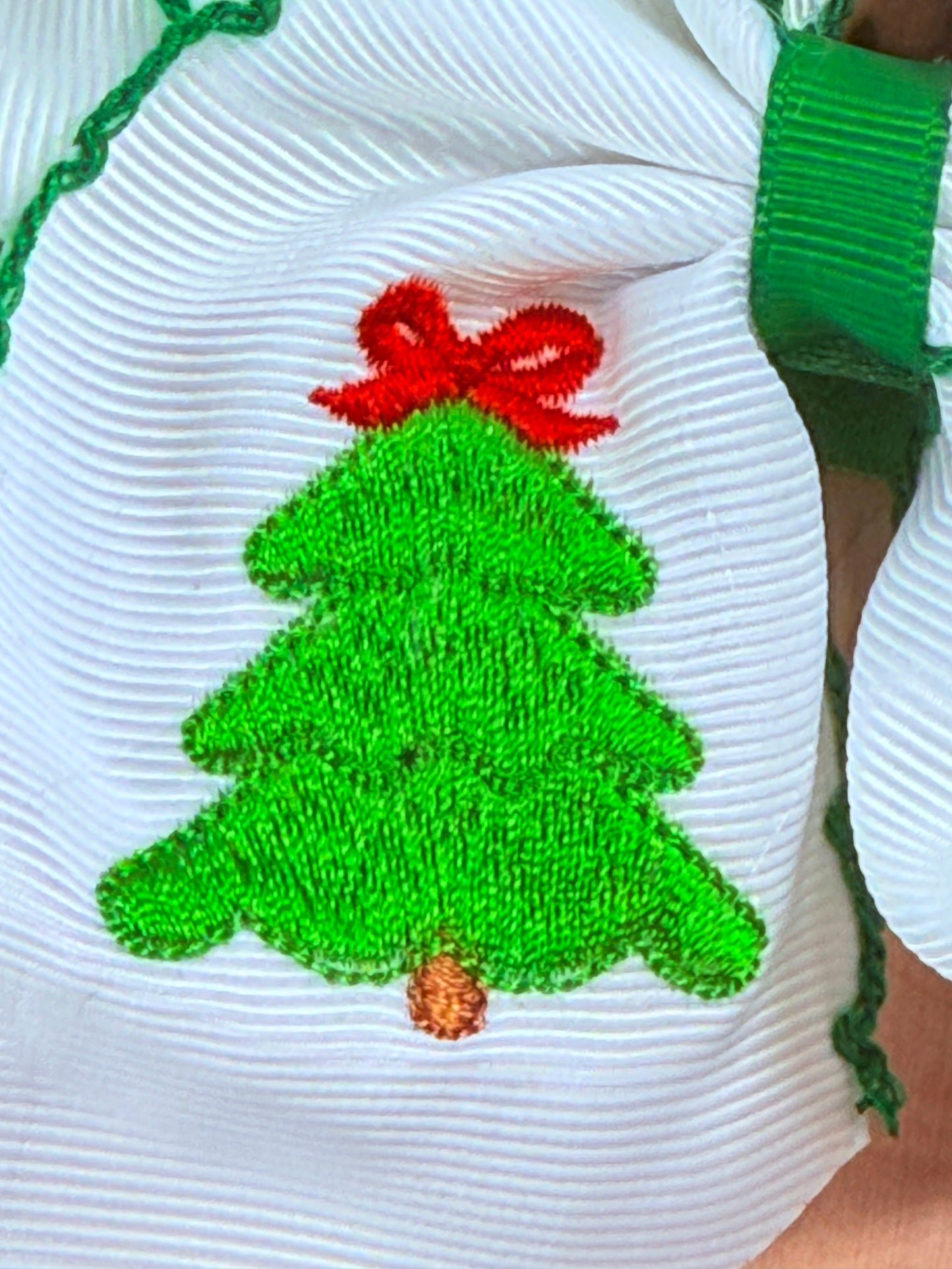 close up photo showing the christmas tree embroidery