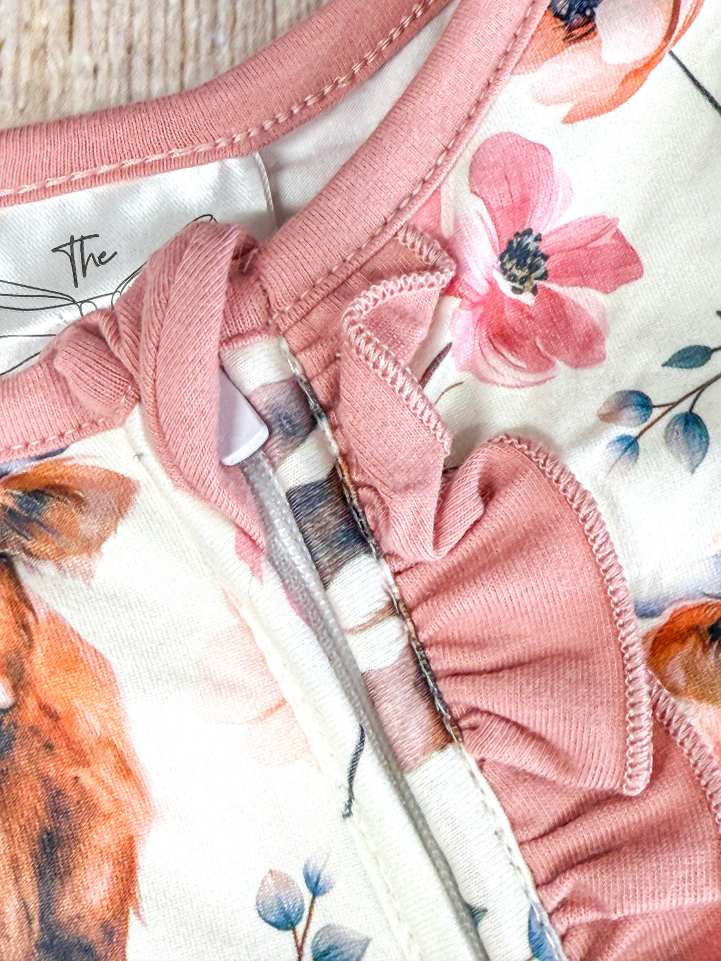 close up of dusty rose ruffles on front