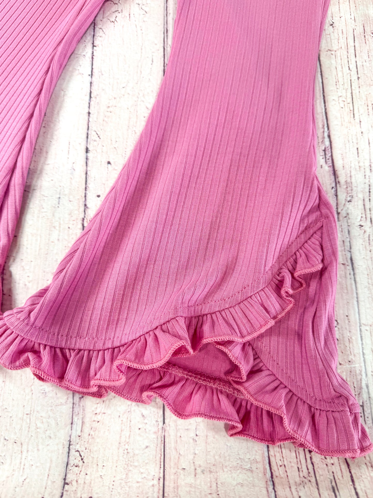 close up of the flared pant leg with ruffles