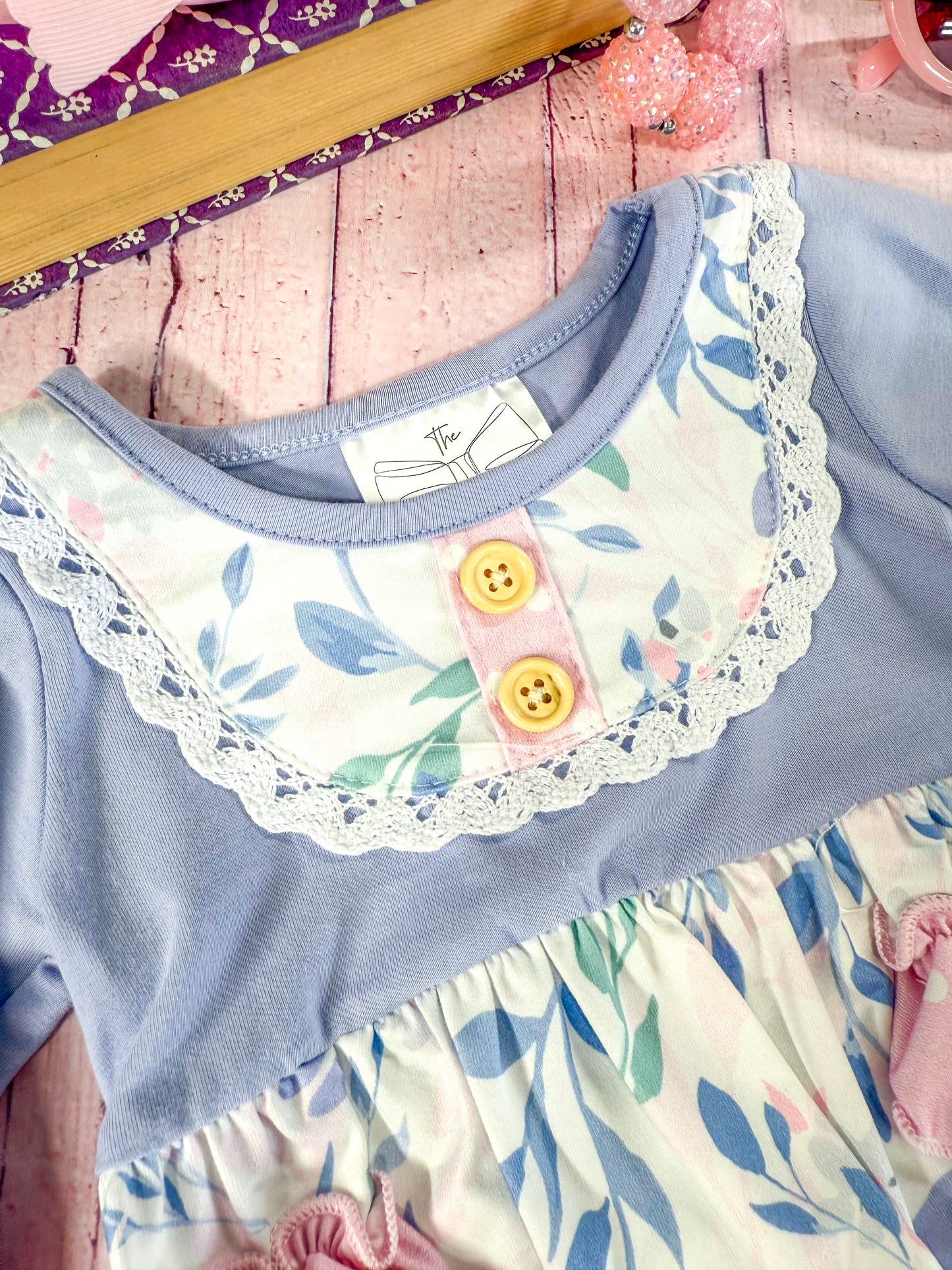 close up of the apron stitching on front of romper