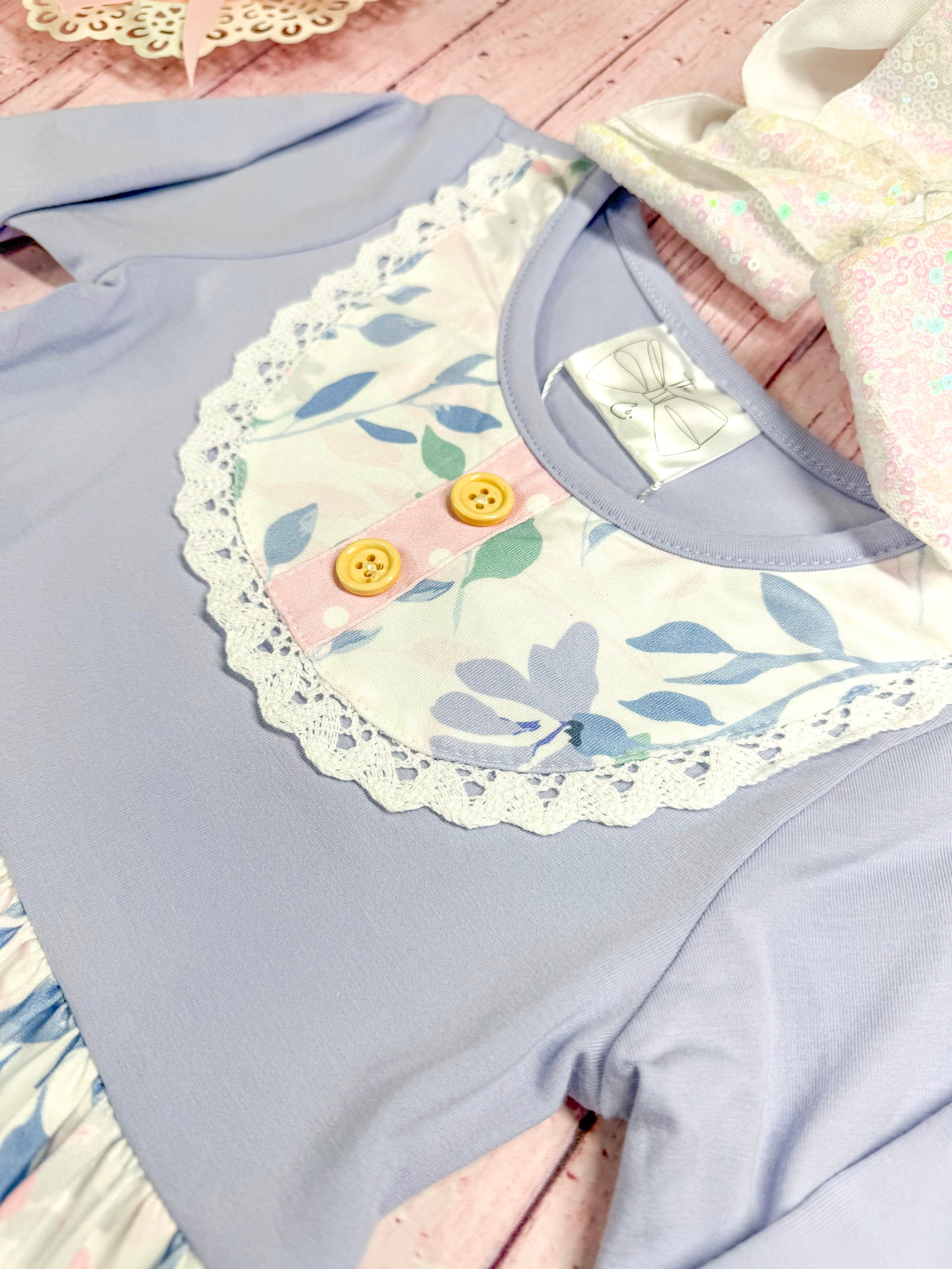 close up of the apron stitching on front oft he dress