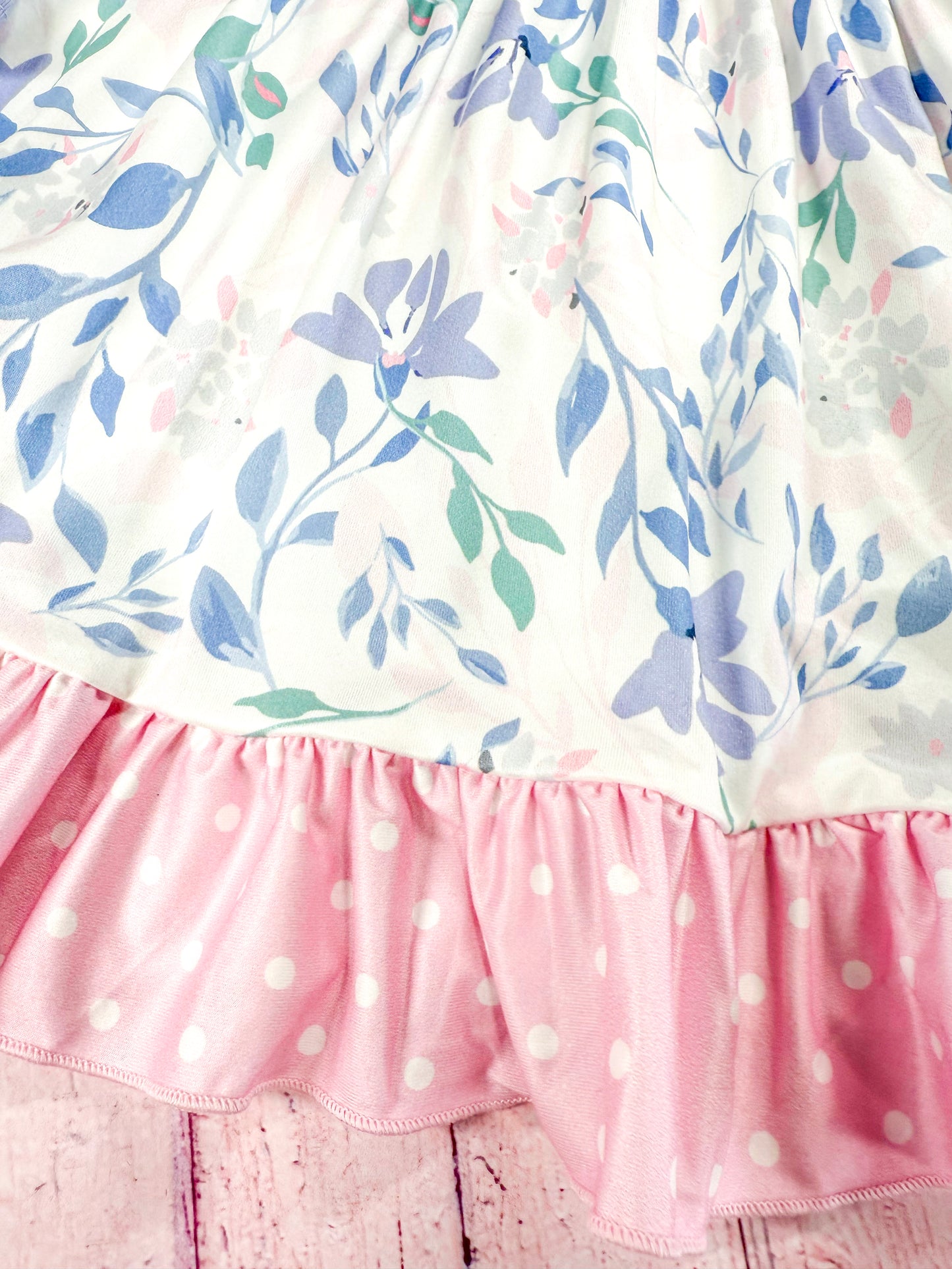 close up of the floral patterns on tiered skirt