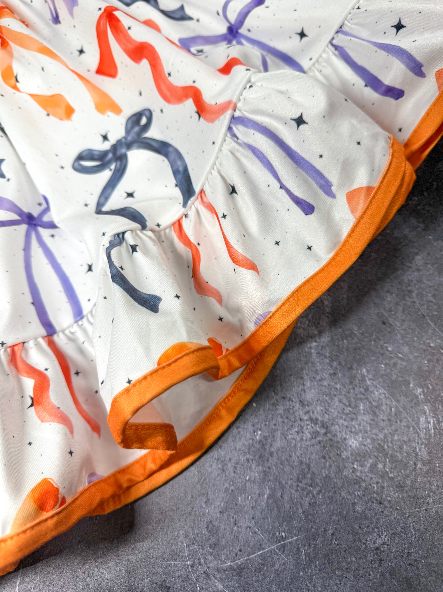 close up of orange trim on dress