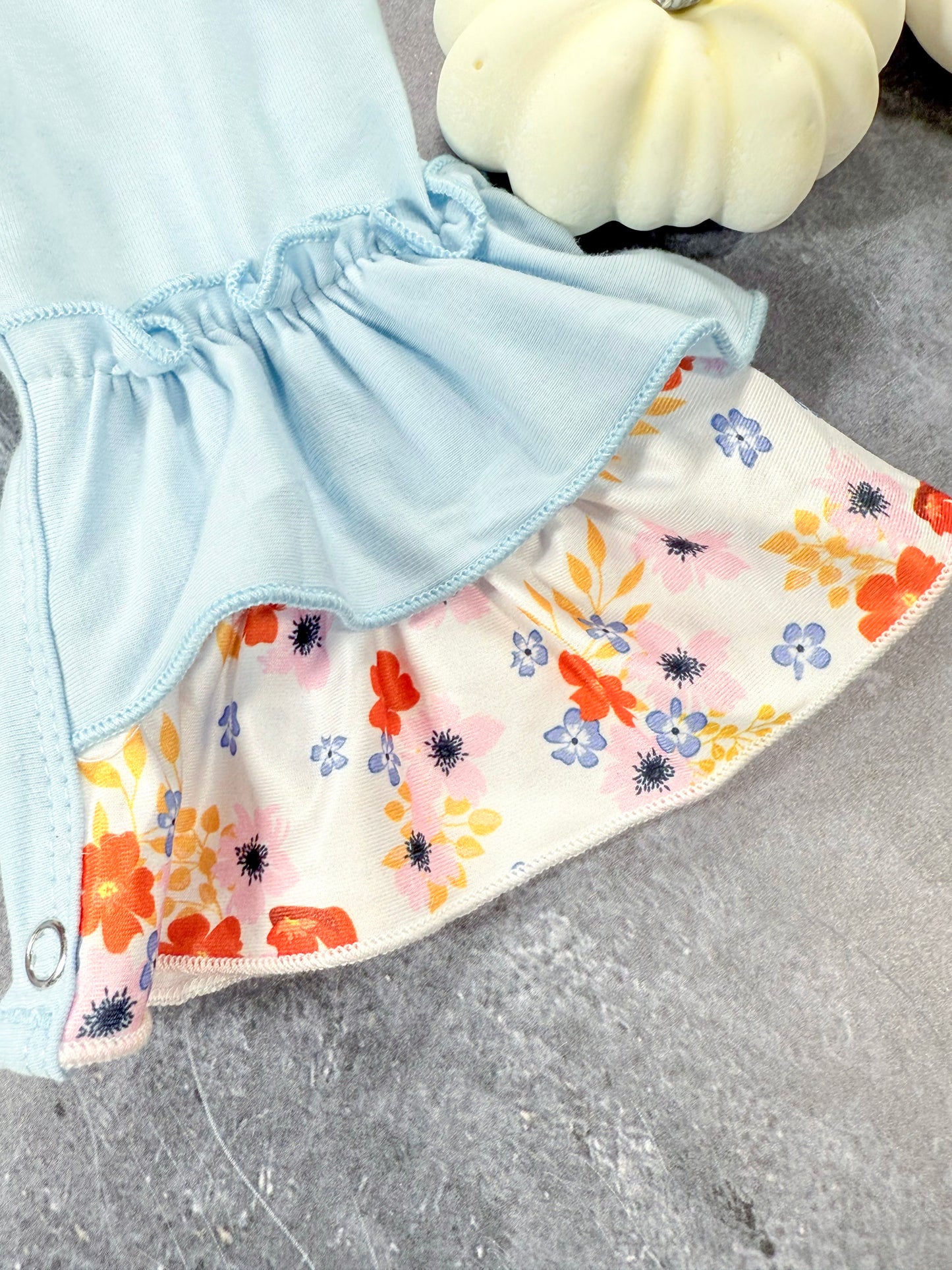 close up of floral ruffle pant leg