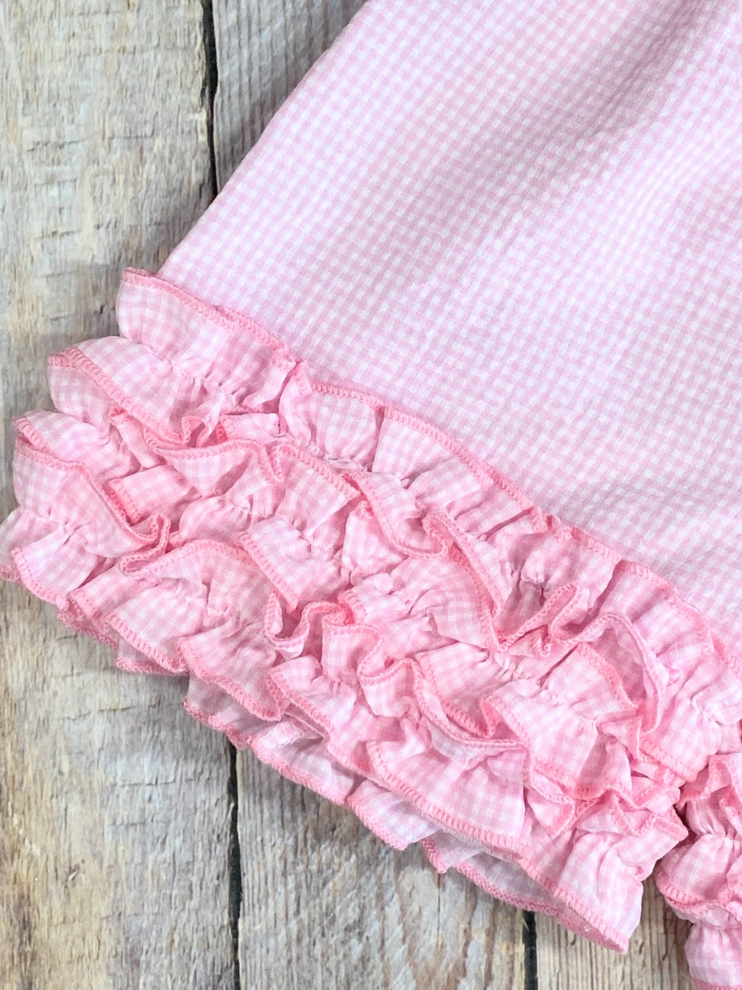 Close up detail photo of ruffles on the shorts