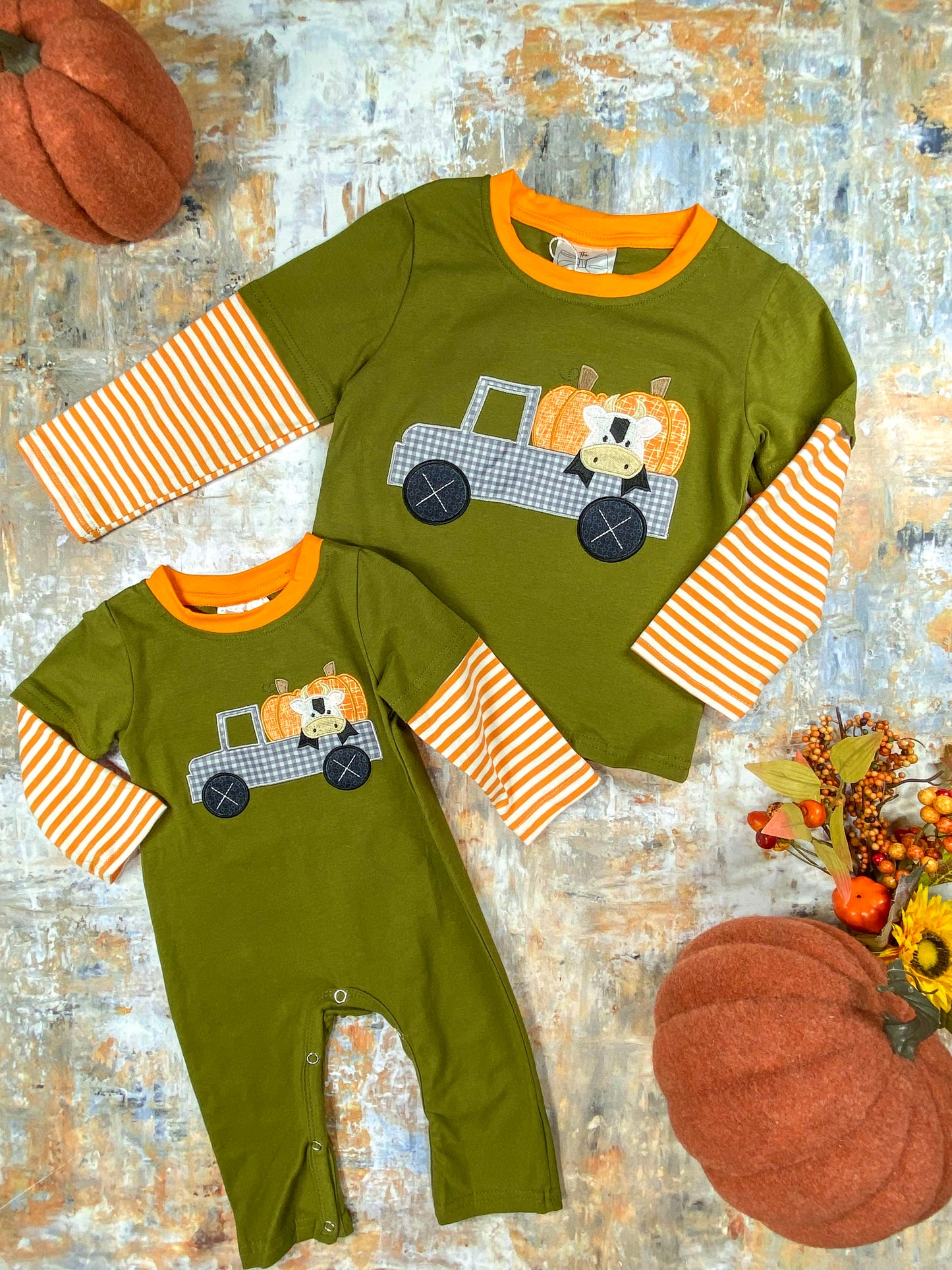Haulin' Pumpkins Infant Boy's Romper next to matching boy's shirt