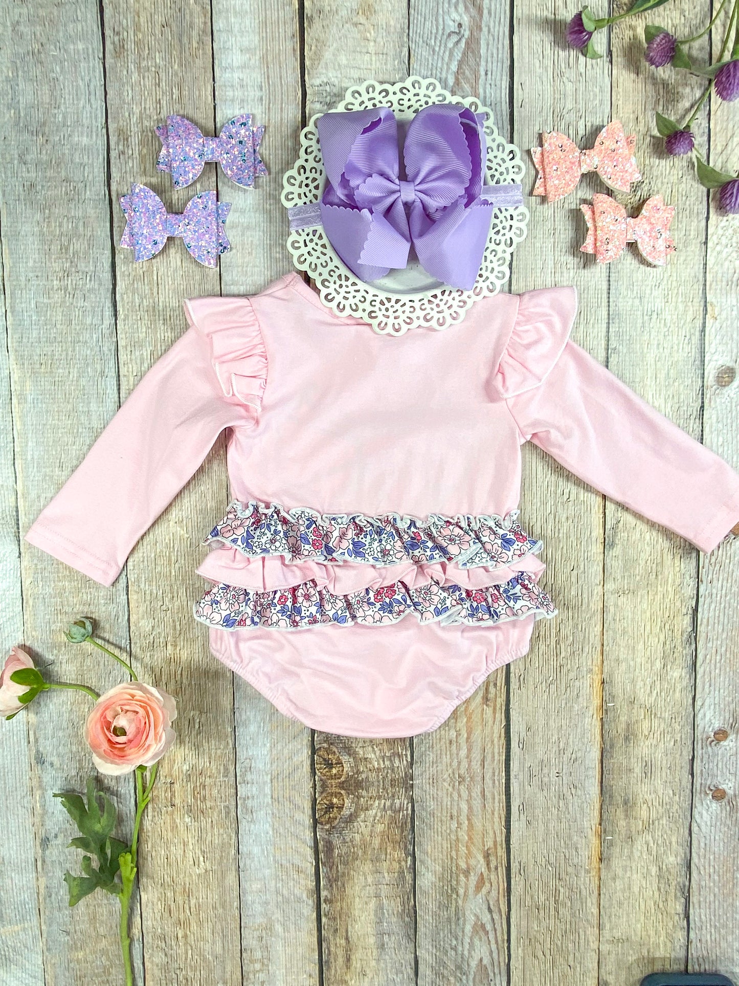 back of the romper showing the ruffles