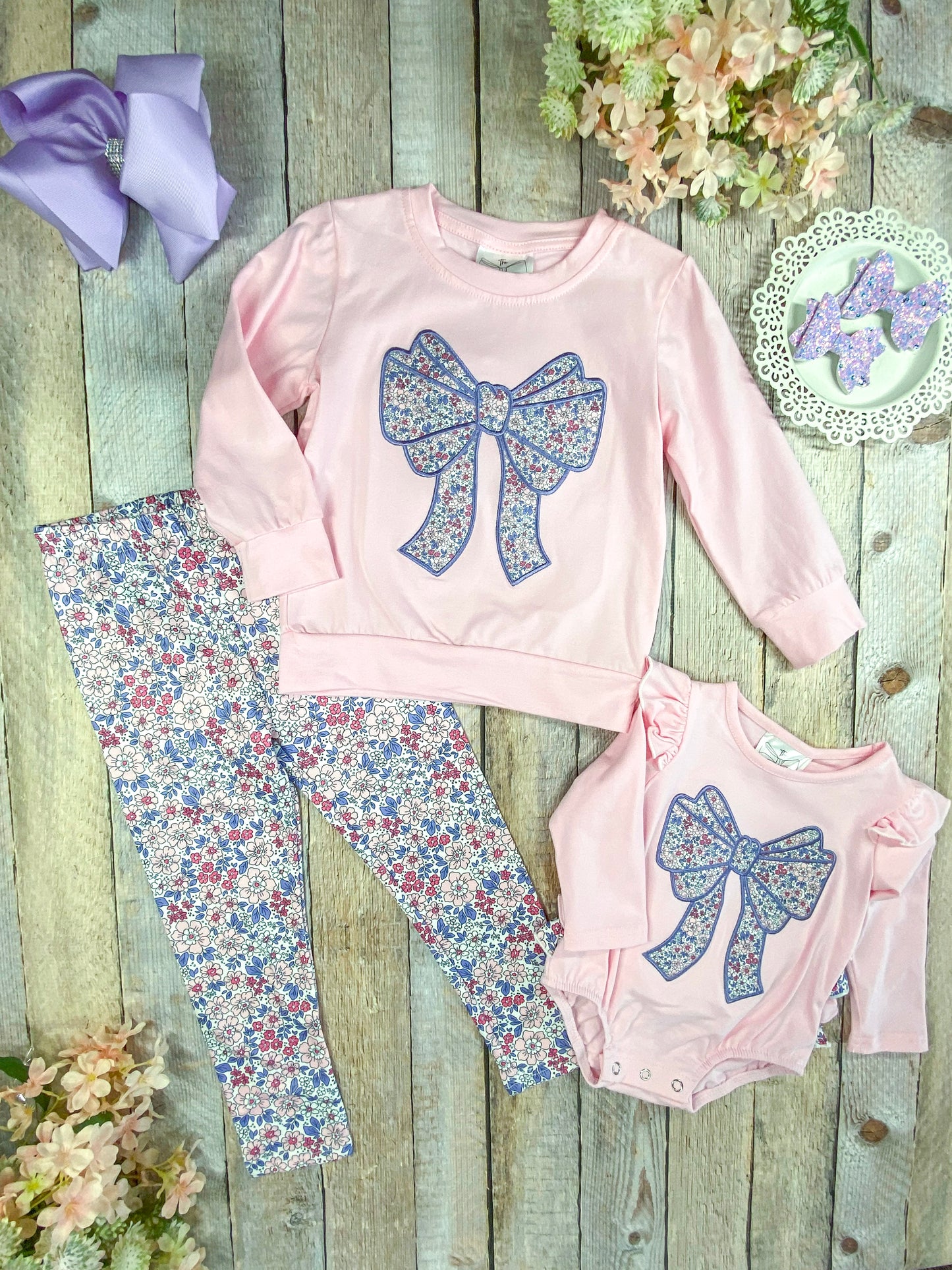 infant romper next to the matching girl's outfit
