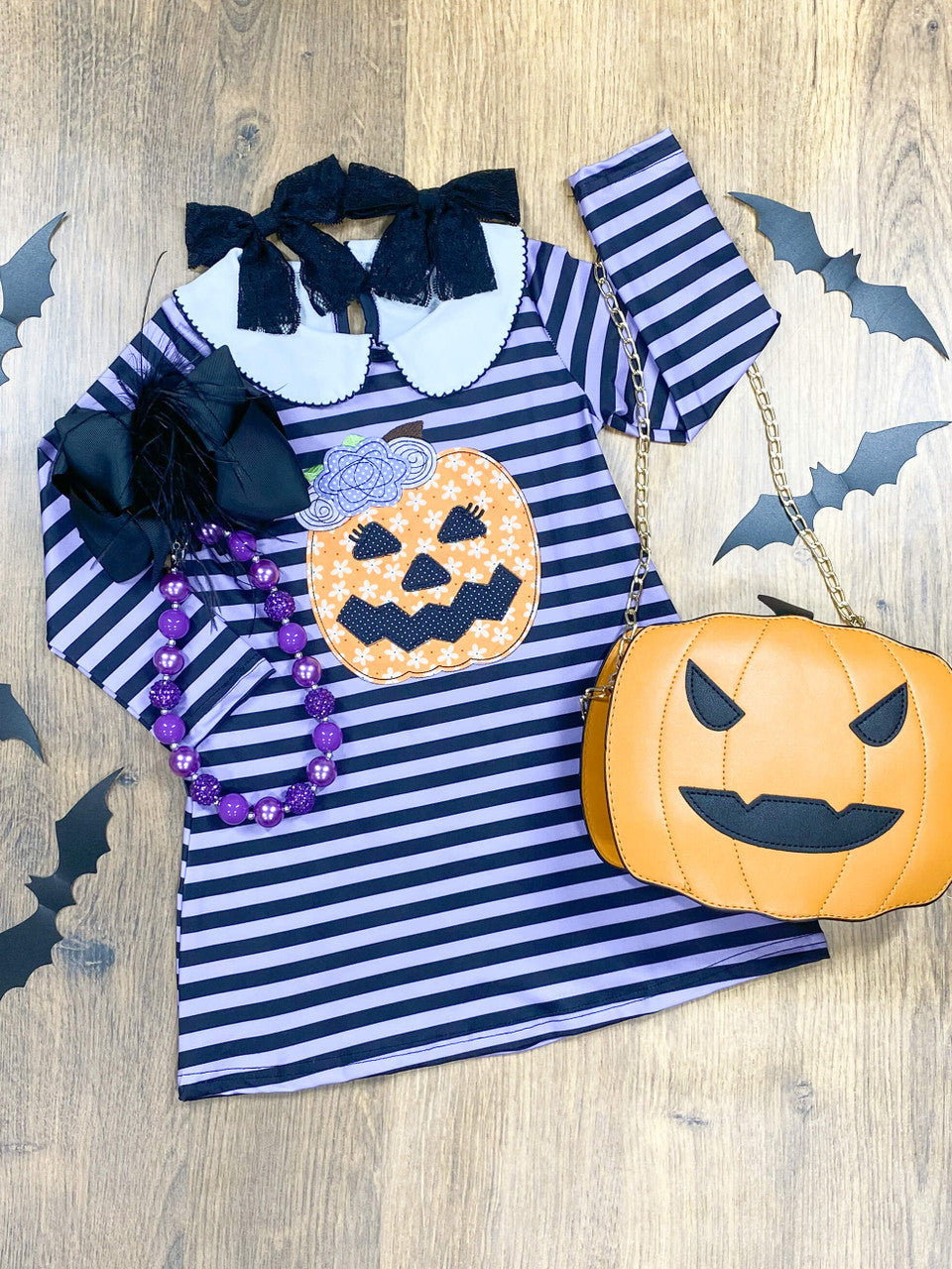 black and purple striped dress with cute jack-o-lantern