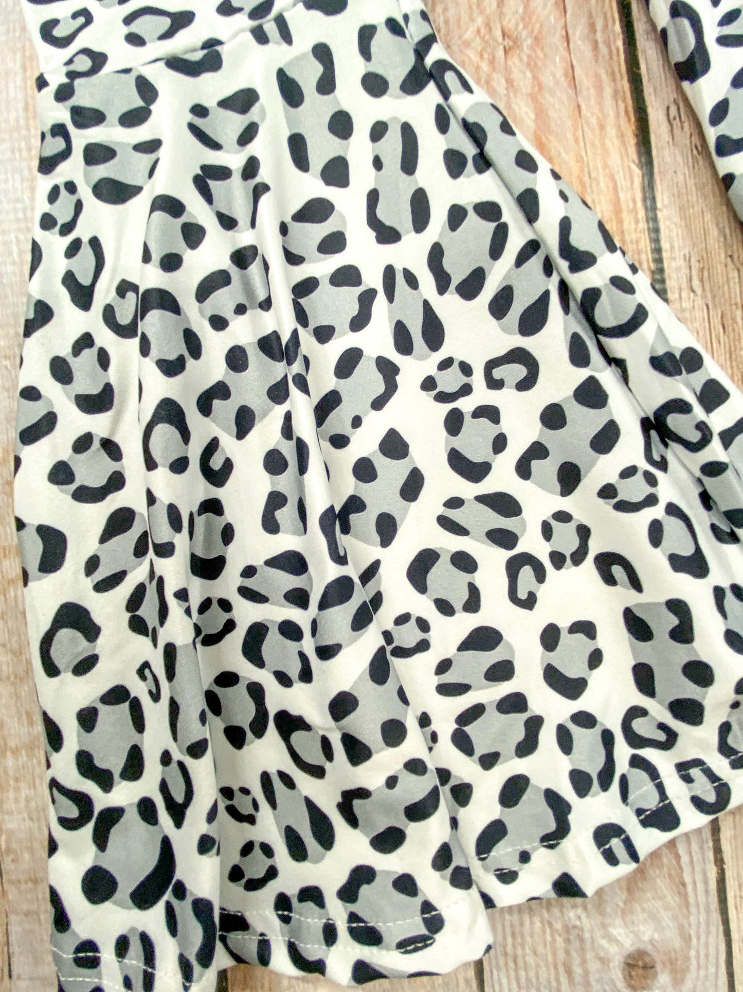 close up of the animal print on the bell bottom pants