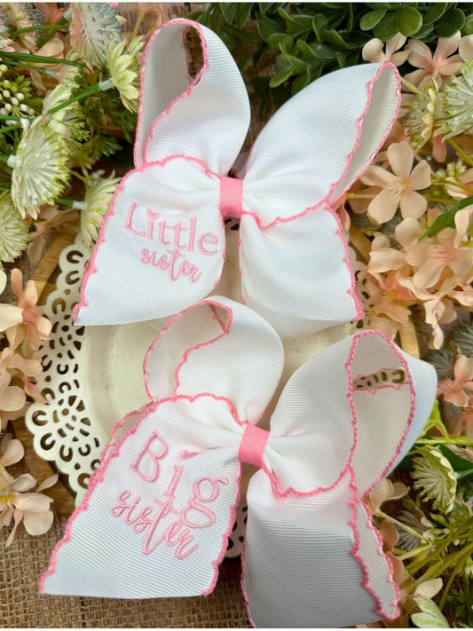 Matching Big Sister and Little Sister white embroidered hair bows with pink lettering and scalloped pink edges, displayed together. - Alternative view