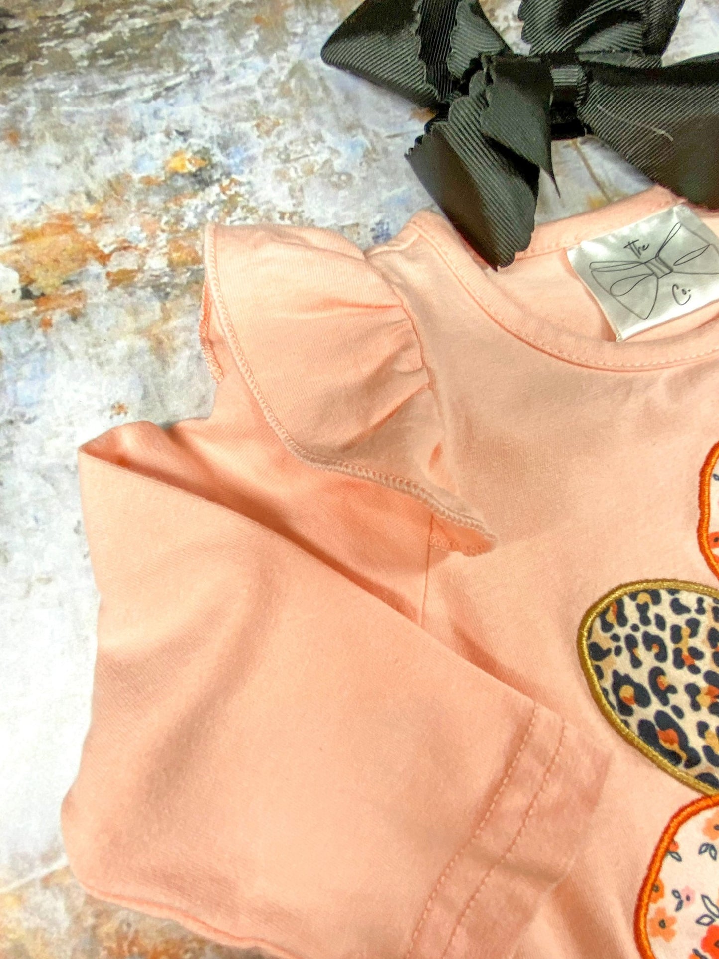 close up of the ruffle on shoulder