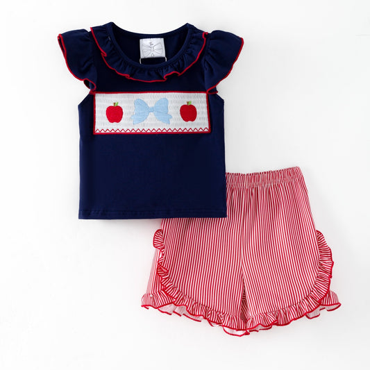 Navy top with red and white accents and red striped shorts on a white background - Alternative view