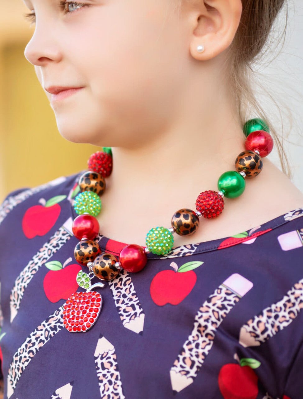 apple necklace on child