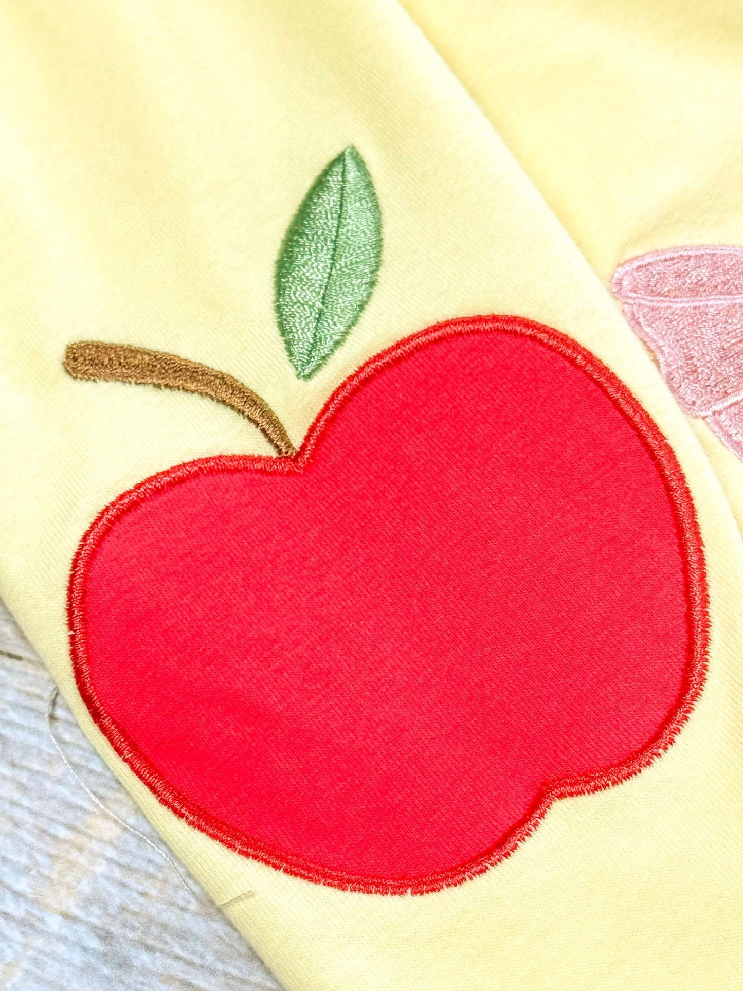 Red apple patch on a yellow background