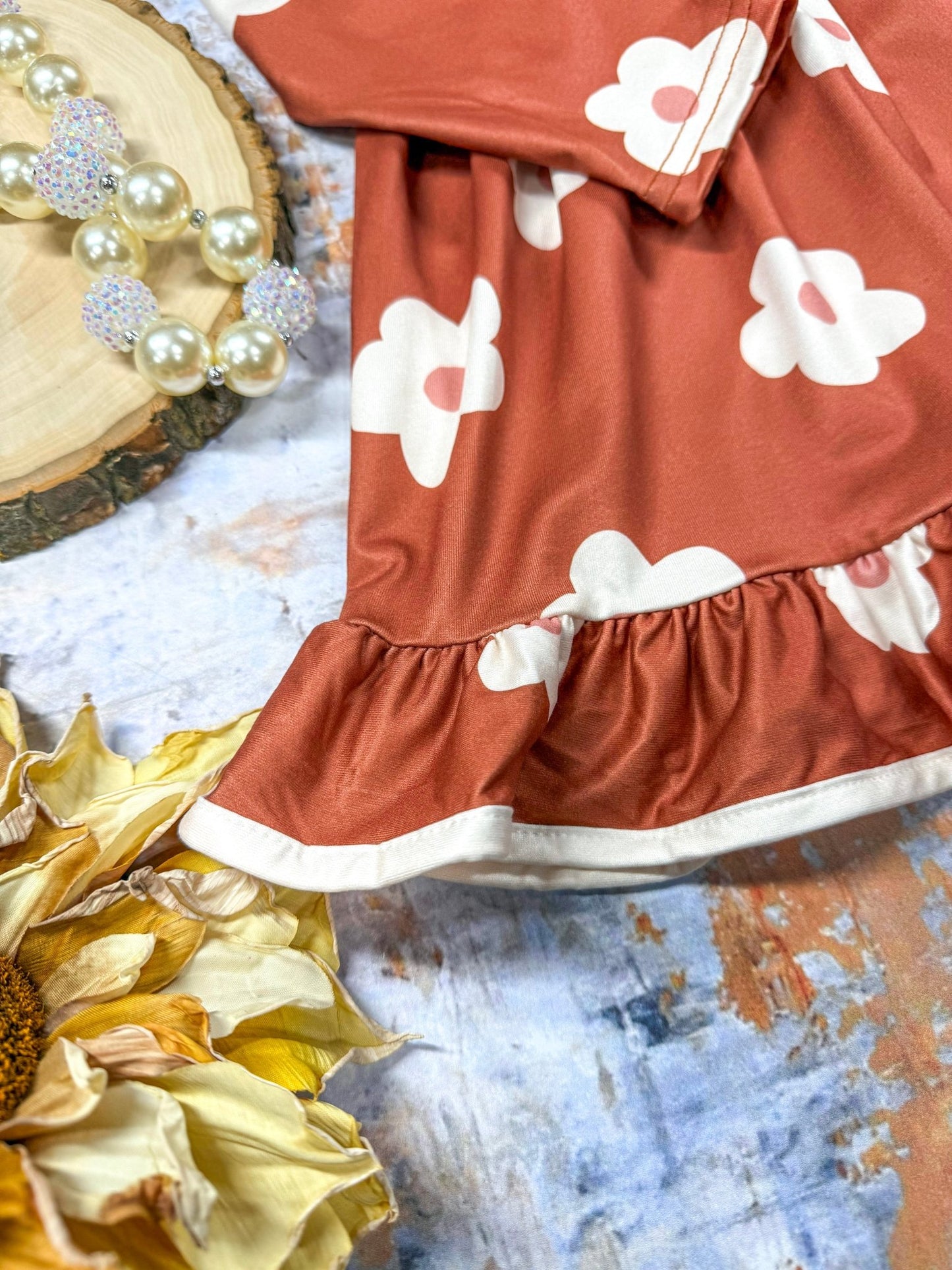 close up of the tiered style and trim on the bottom of dress