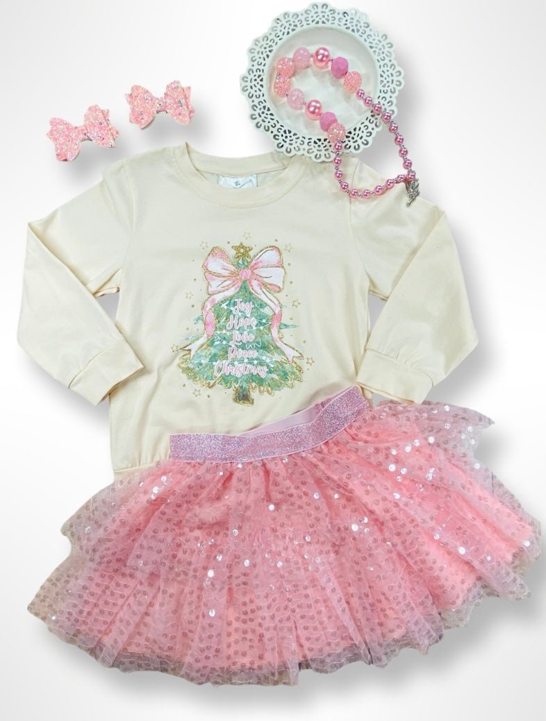 Children's outfit with long-sleeve top and pink tutu skirt on a white background
