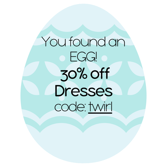 teal and blue Easter egg-shaped sign with promotional text and code. - Alternative view