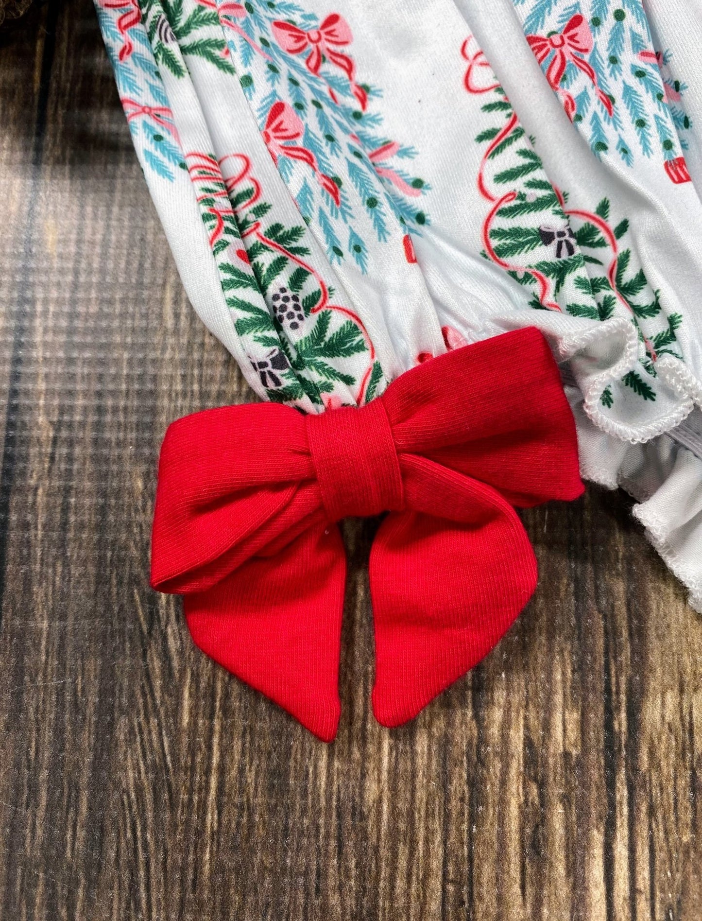 Holiday infant romper bow detail, part of sibling set for kids’ Christmas outfits