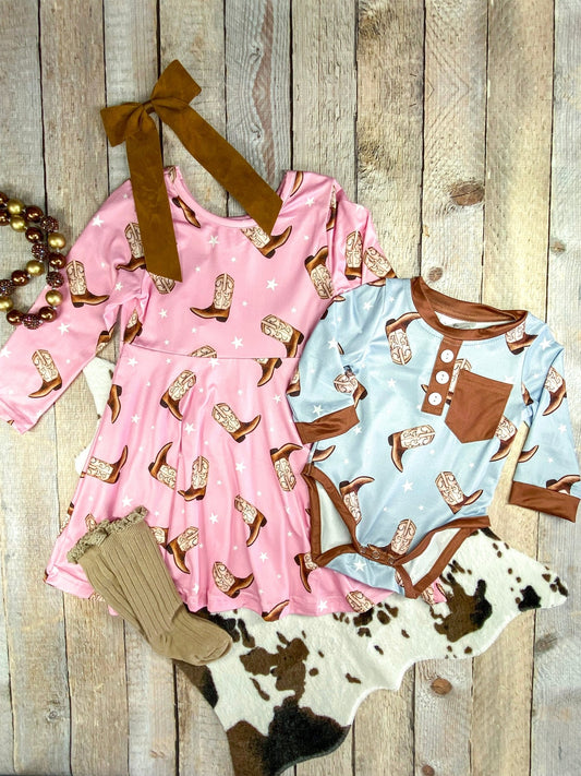 Cowgirl Boots Pink Twirl Dress next to matching infant boy romper (in blue) - Alternative view