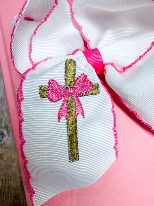 Close-up of cross embroidery and pink moonstitch trim on hair bow - Alternative view