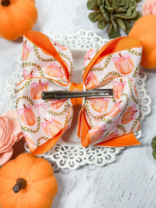 Back of double layered pumpkin hair bow showing alligator clip - Alternative view