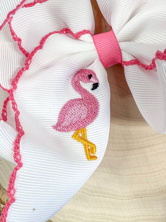 Close-up of flamingo embroidery detail on hair bow - Alternative view