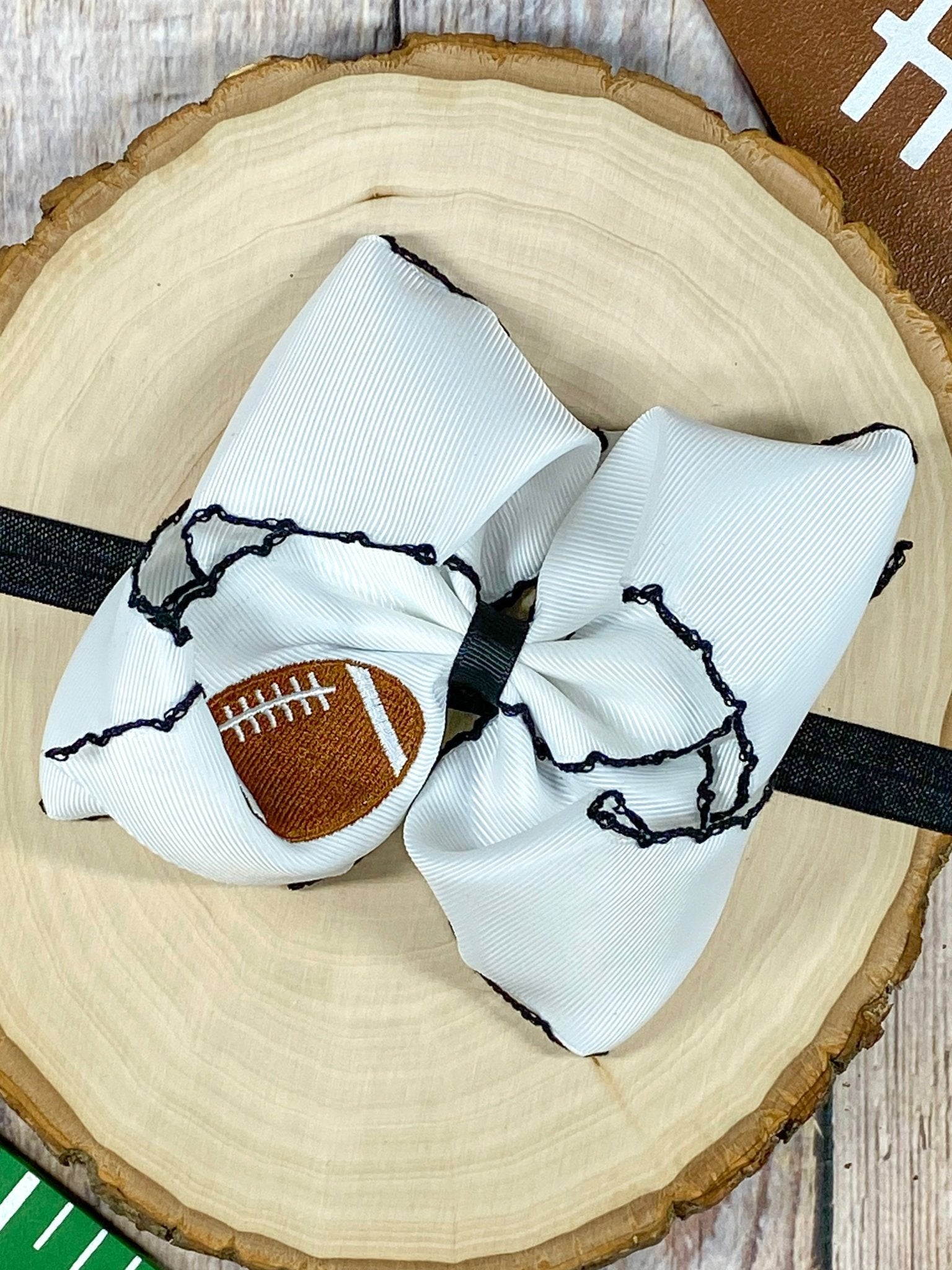 Football Embroidered Moonstitch Bow Headband with black stitching