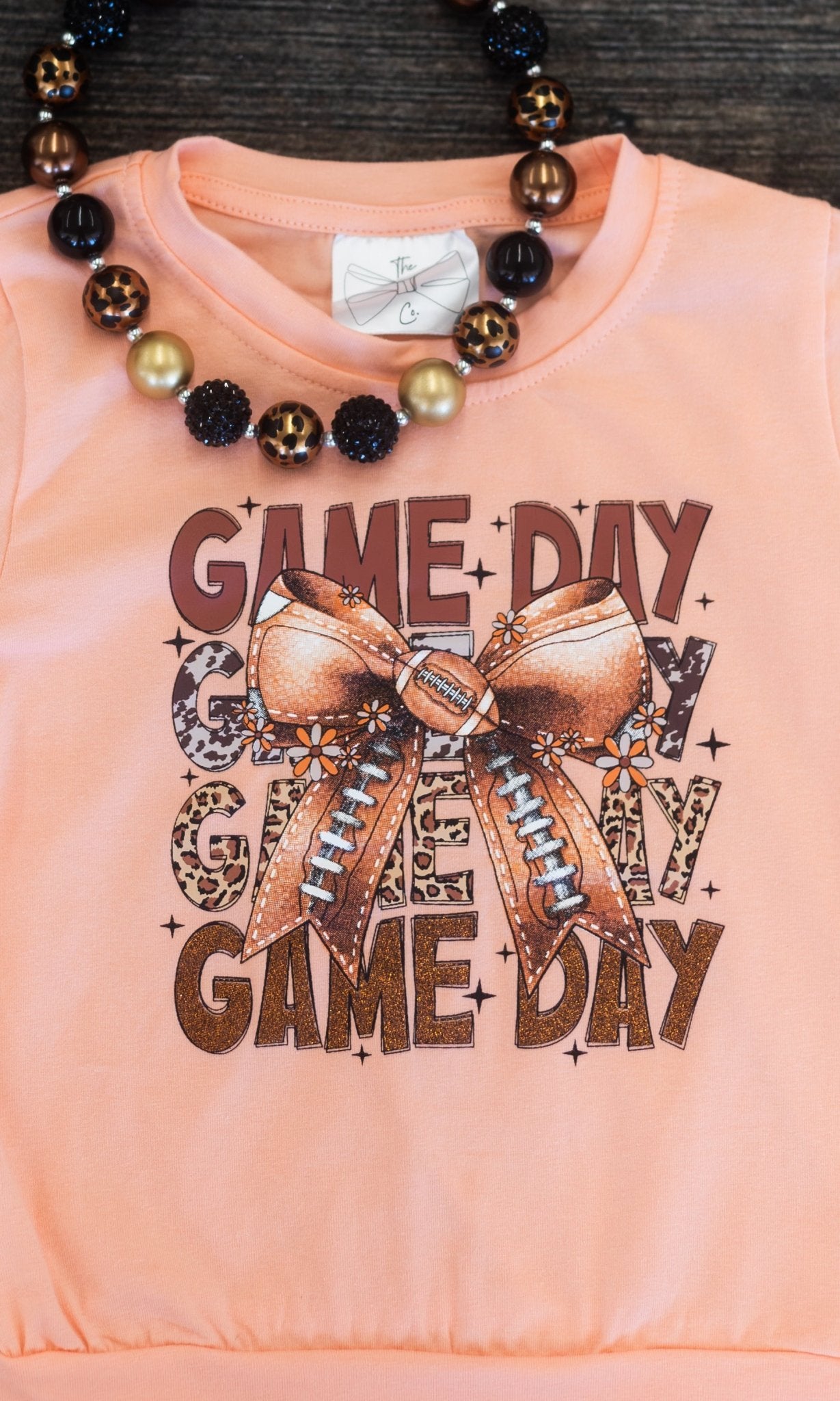 close up of the "game day" graphic on front of the shirt