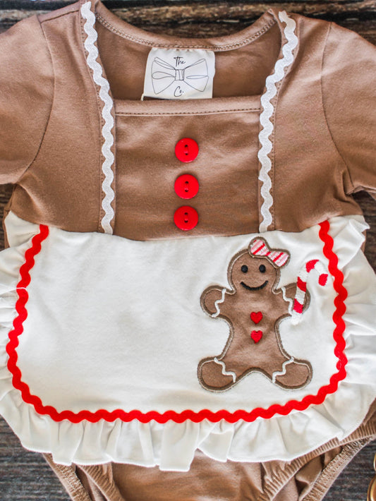 Children's outfit with gingerbread design on a wooden surface - Alternative view