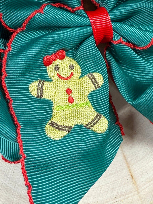 Close-up of gingerbread embroidery and moonstitch detail on hair bow - Alternative view