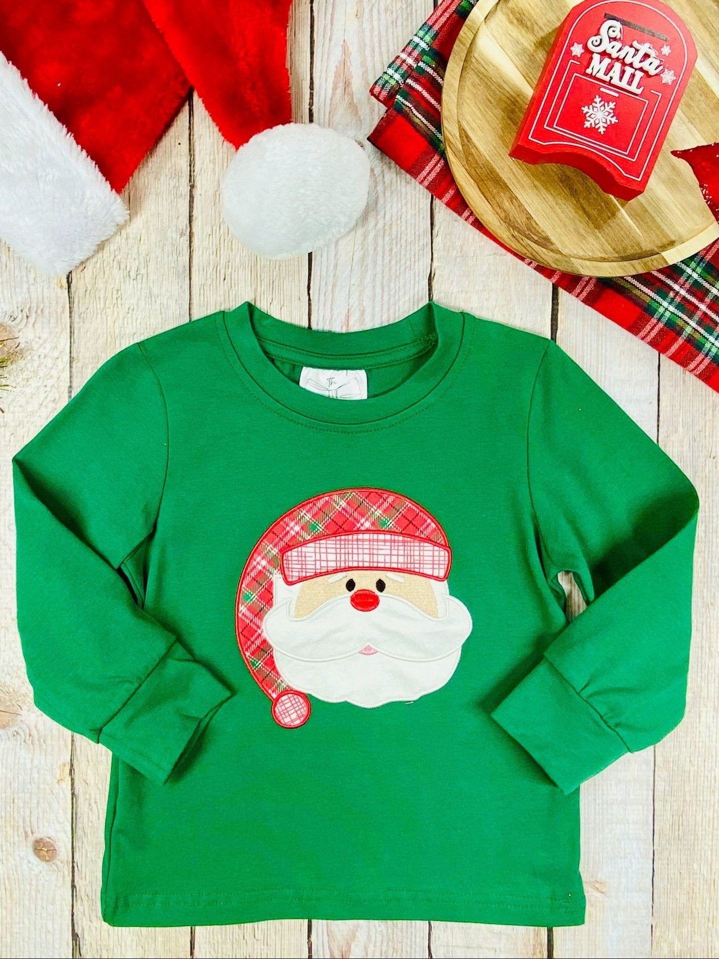 Boys’ green long sleeve shirt with red plaid Santa applique, perfect for holiday photos and events.
