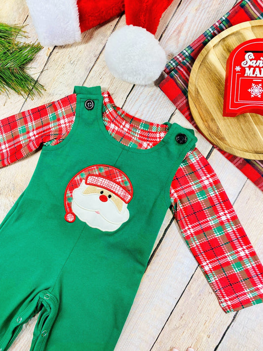 Angled shot of festive baby boy Christmas outfit with plaid sleeves and Santa face detail on the chest. - Alternative view