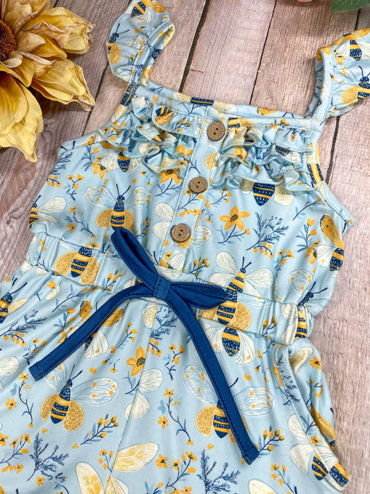 Children's romper with bee and floral pattern on a wooden surface - Alternative view