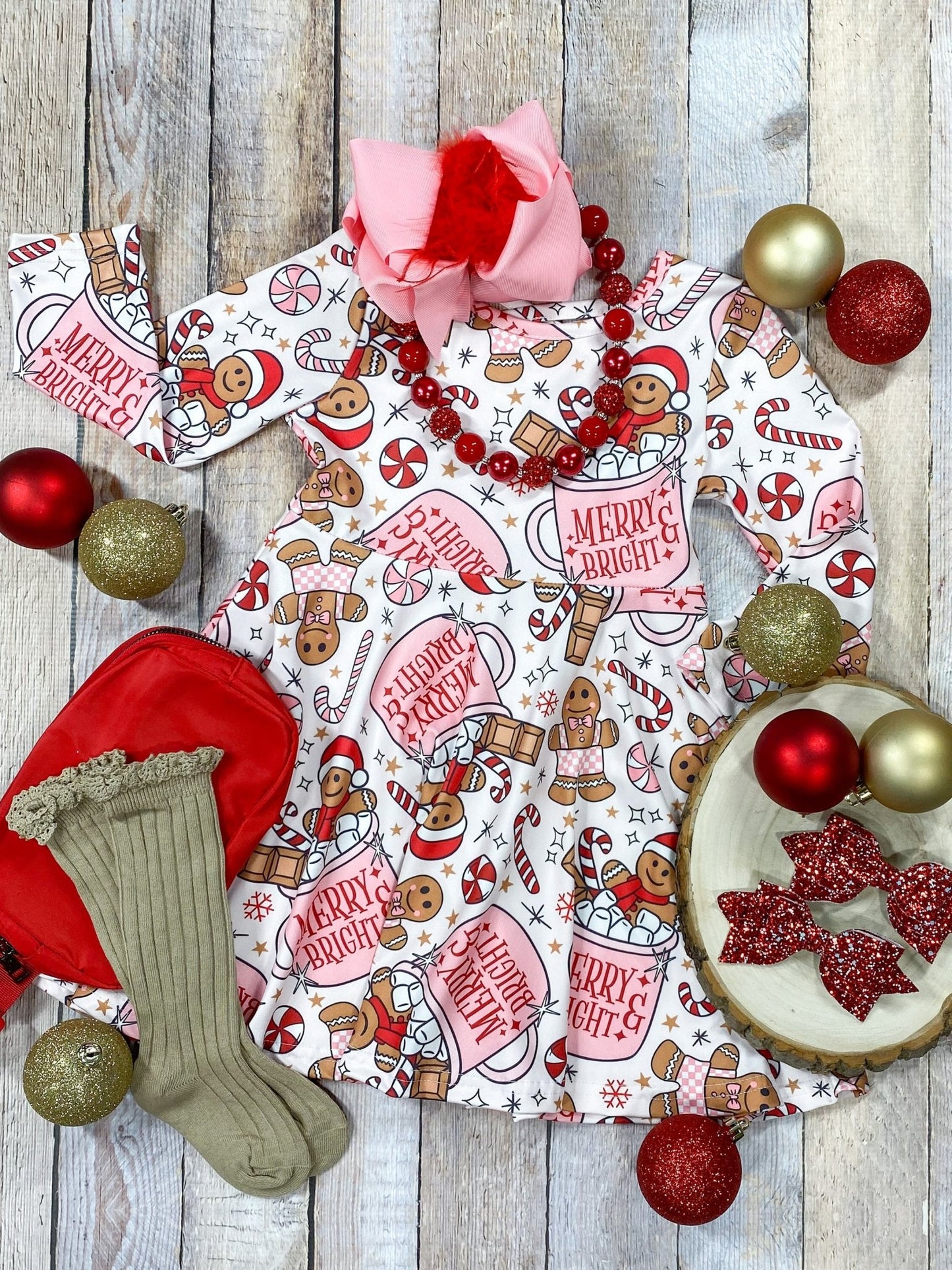 Hot cocoa girls dress on wooden background with ornaments and accessories