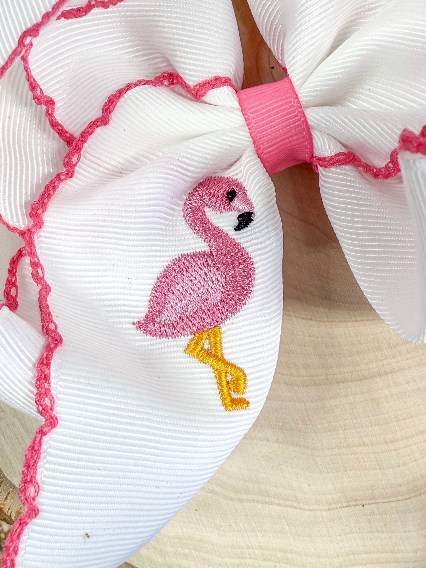 close up of flamingo embroidery