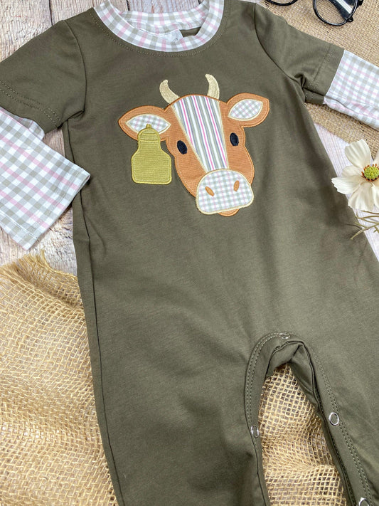 baby boy western one-piece with cow appliqué and faux gingham layered sleeves on a wooden background - Alternative view