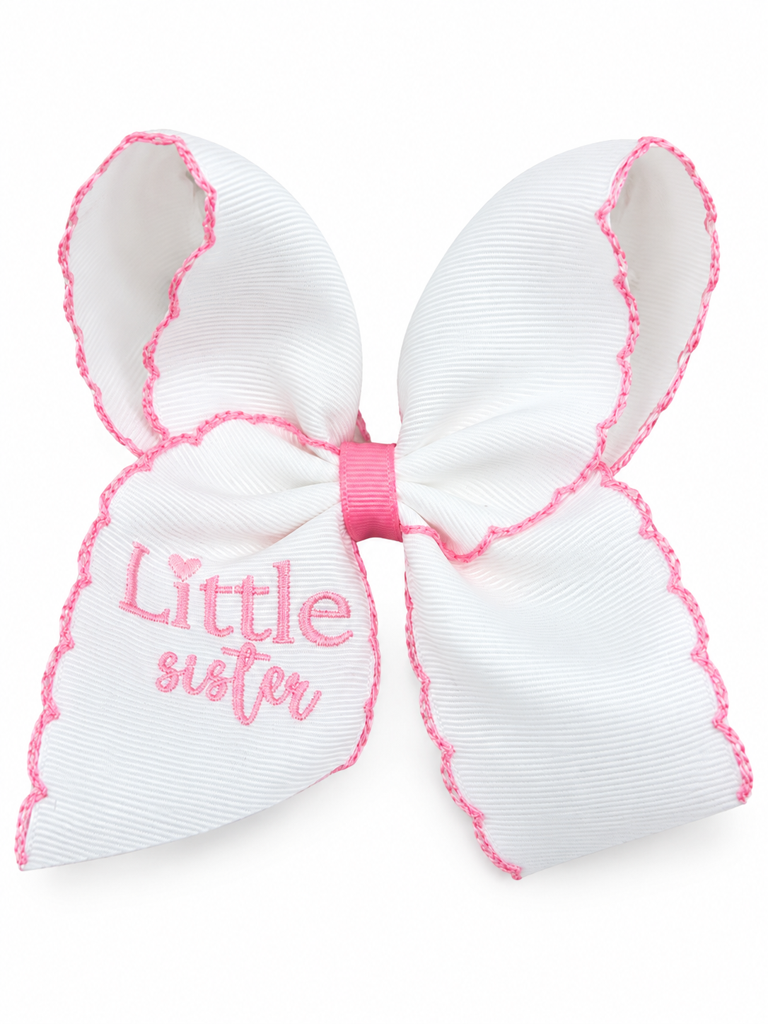 White Little Sister embroidered hair bow with pink lettering, scalloped pink stitching along the ribbon edges and a pink center wrap.