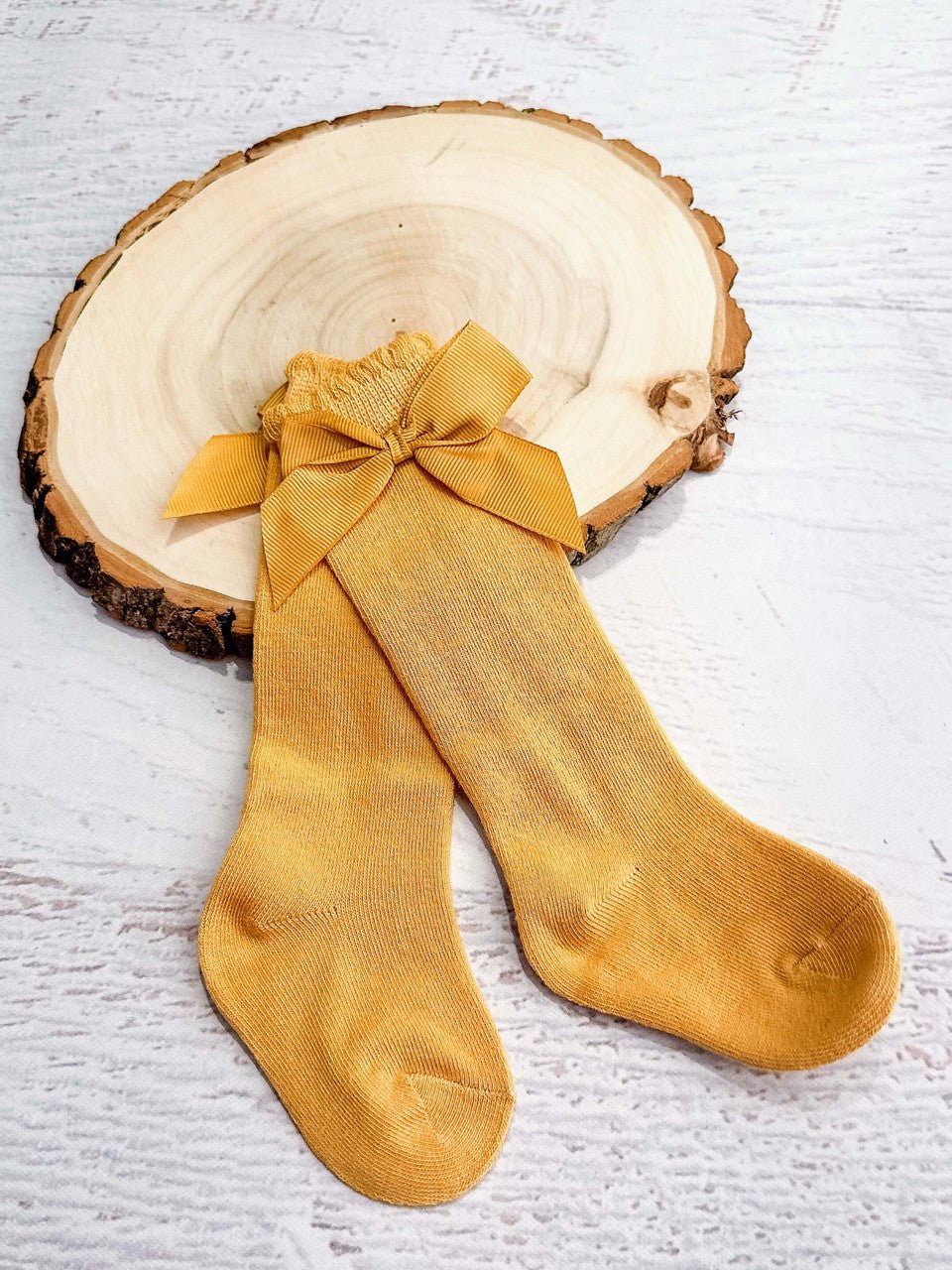 Mustard yellow socks with a bow