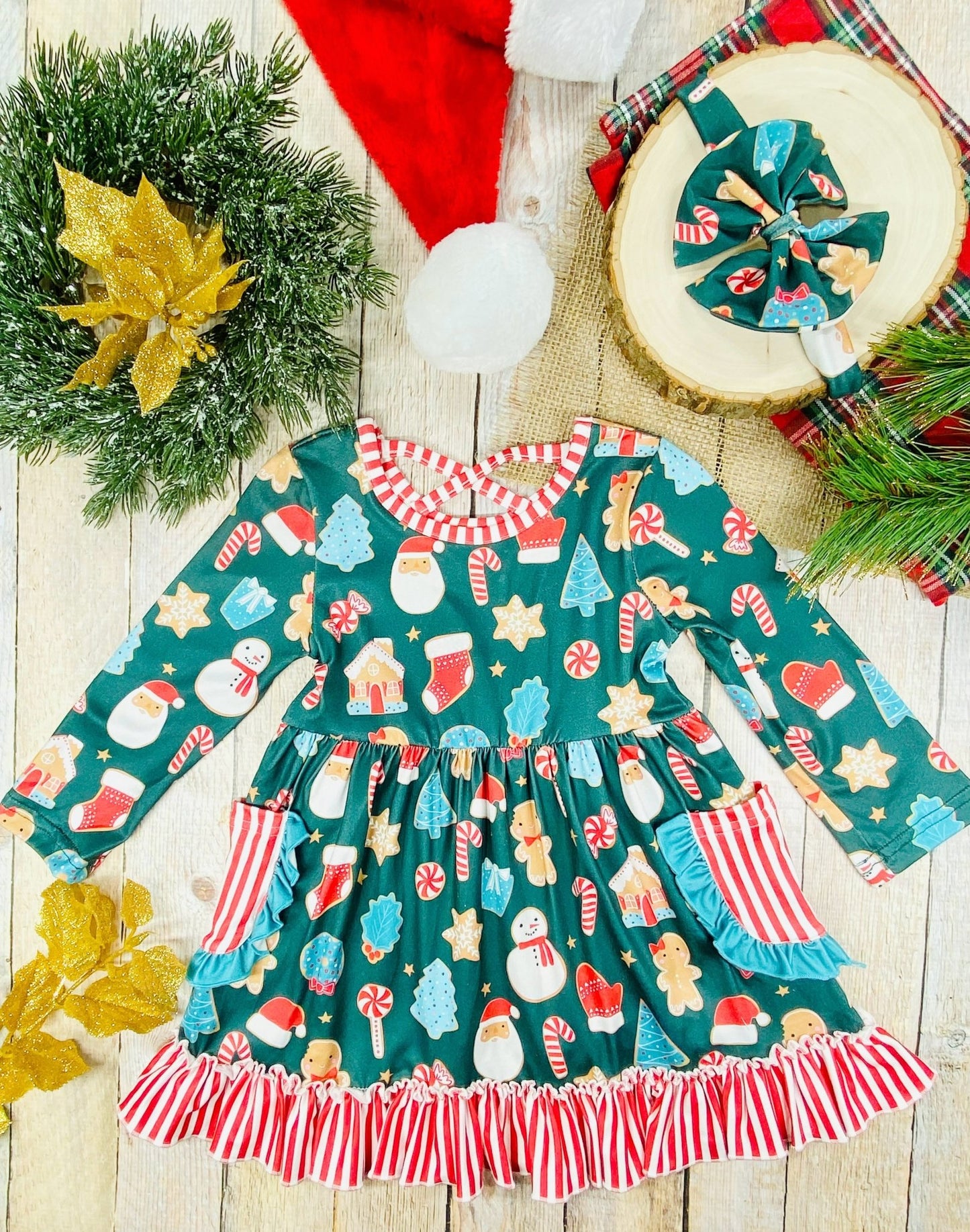 Girls’ long sleeve Christmas twirl dress with holiday cookie print, red-and-white striped ruffle hem, front pockets