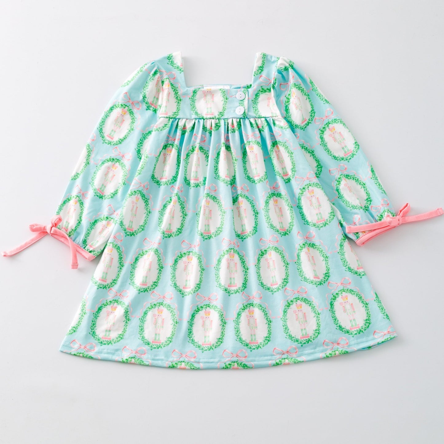 Children's dress with avocado pattern on a light gray background