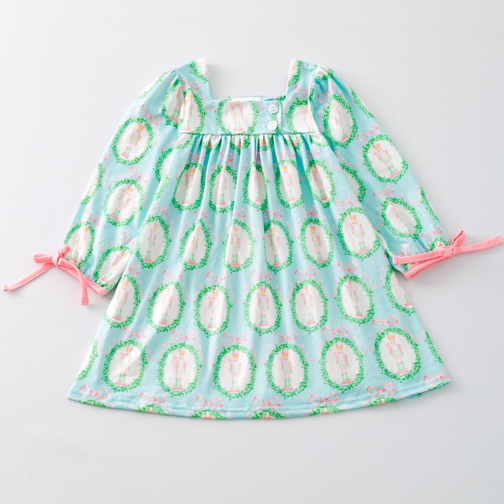 Children's dress with avocado pattern on a light gray background