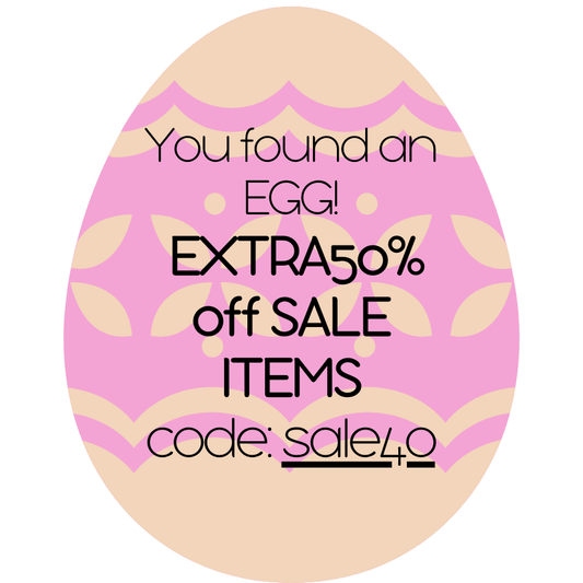 Pink and beige Easter egg-shaped sign with promotional text and code. - Alternative view