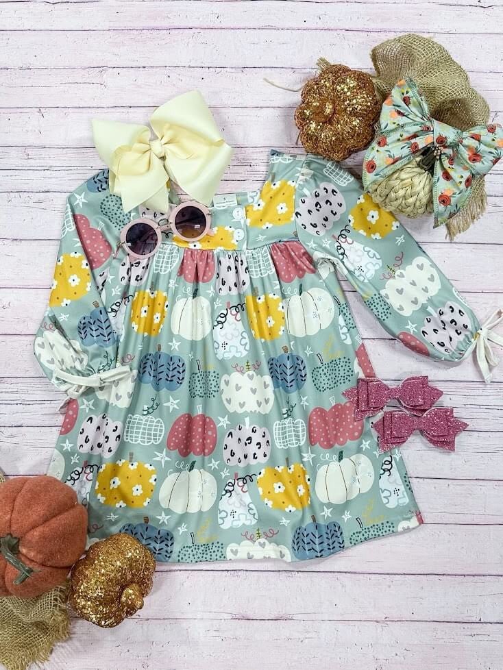 blue dress with an abundance of patterned pumpkins
